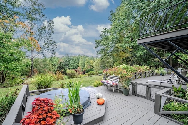 wooden terrace with stairway and a forest view