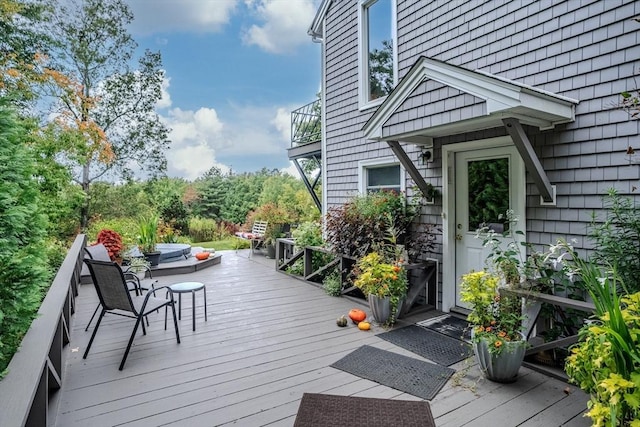 deck featuring outdoor lounge area
