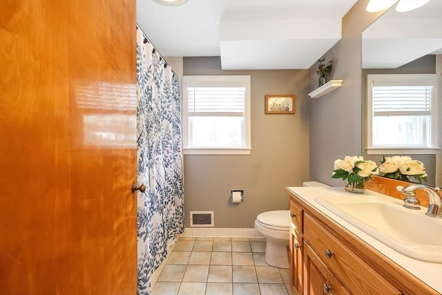 full bath with visible vents, toilet, vanity, baseboards, and tile patterned floors