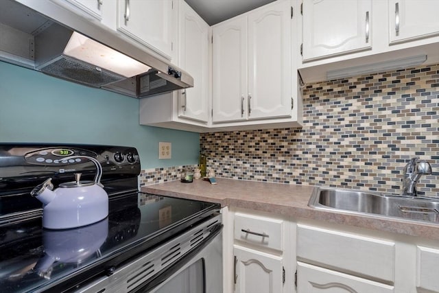 kitchen with white cabinetry, stainless steel electric range oven, sink, and tasteful backsplash