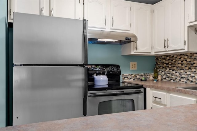 kitchen featuring stainless steel appliances, white cabinetry, and backsplash