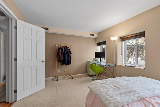 bedroom with light colored carpet