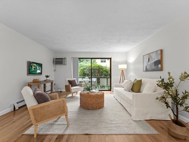 living room featuring a baseboard radiator, wood finished floors, a wall unit AC, and baseboards