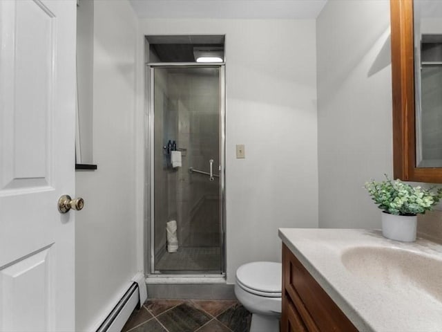 bathroom featuring a shower stall, vanity, toilet, and a baseboard radiator