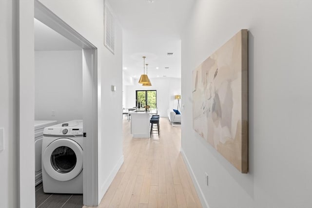 7 Wordsworth Unit Ph6, Boston, MA 02128 - laundry room with washer / clothes dryer, light wood-style floors, baseboards, and recessed lighting
