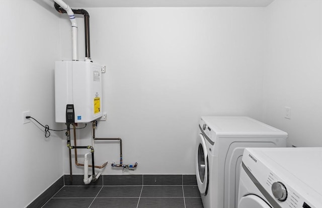 7 Wordsworth Unit Ph6, Boston, MA 02128 - laundry room featuring washing machine and clothes dryer, water heater, tile patterned flooring, and baseboards