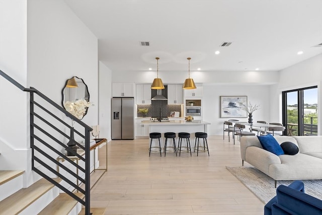 7 Wordsworth Unit Ph6, Boston, MA 02128 - living room with light wood-type flooring, recessed lighting, and stairs