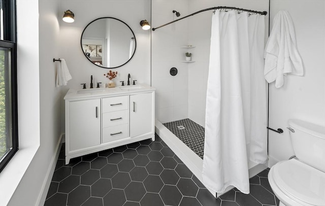 7 Wordsworth Unit Ph6, Boston, MA 02128 - bathroom with healthy amount of natural light, toilet, tiled shower, and tile patterned floors