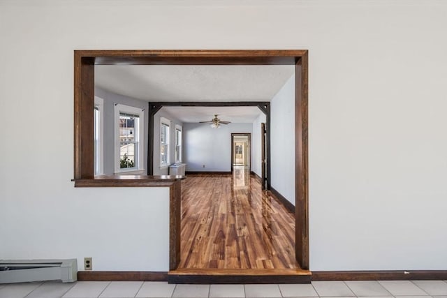 hallway with a baseboard heating unit