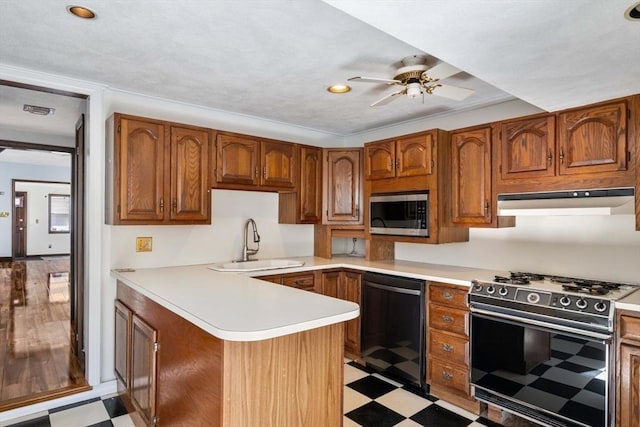 kitchen with sink, range with gas cooktop, kitchen peninsula, black dishwasher, and ceiling fan