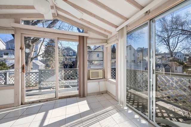 unfurnished sunroom with lofted ceiling with beams