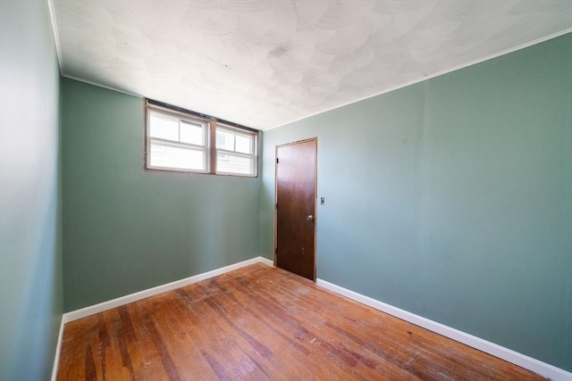 unfurnished room featuring hardwood / wood-style floors