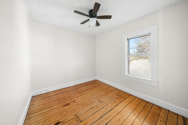 empty room featuring hardwood / wood-style flooring and ceiling fan