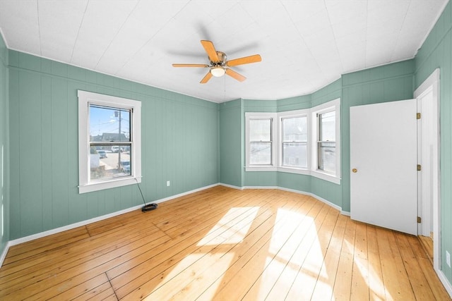 unfurnished room featuring ceiling fan and light wood-type flooring