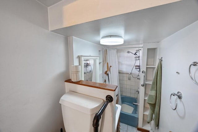 bathroom with shower / bath combo and toilet