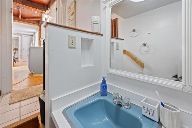 bathroom with a sink and wood finished floors