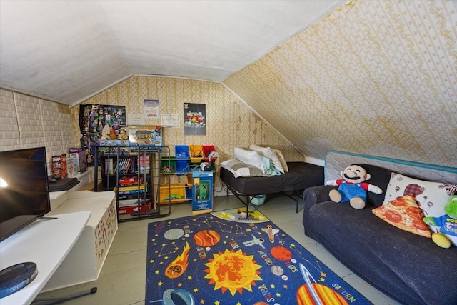 playroom with vaulted ceiling and wallpapered walls