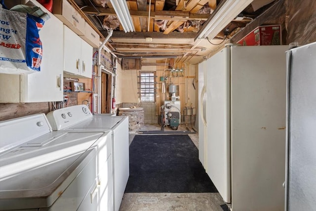 laundry area featuring cabinet space, a heating unit, and independent washer and dryer