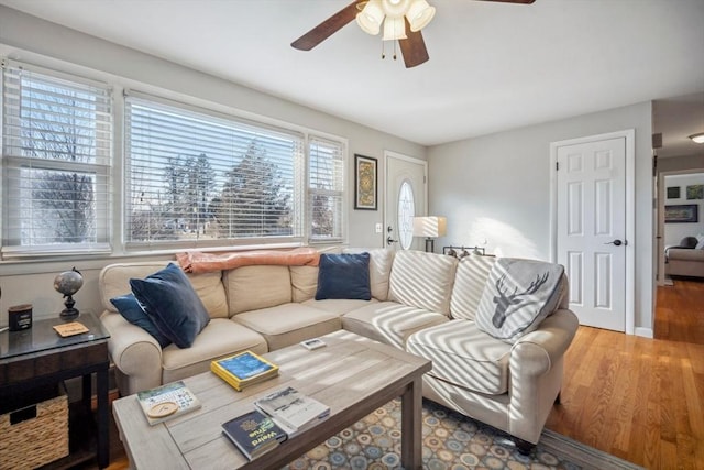 living room with ceiling fan and wood finished floors