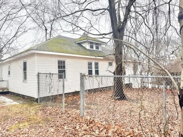 view of side of property with fence