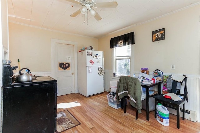 479 Main St, Hanson, MA 02341 - dining space featuring ornamental molding, a wainscoted wall, ceiling fan, and light wood-style floors