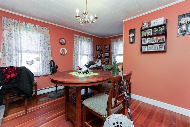 479 Main St, Hanson, MA 02341 - dining area featuring ornamental molding, a chandelier, baseboards, wood-type flooring, and a baseboard radiator
