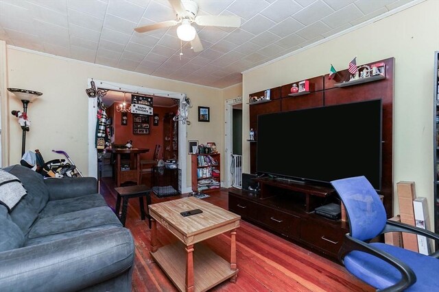 479 Main St, Hanson, MA 02341 - living room featuring wood finished floors, crown molding, and a ceiling fan