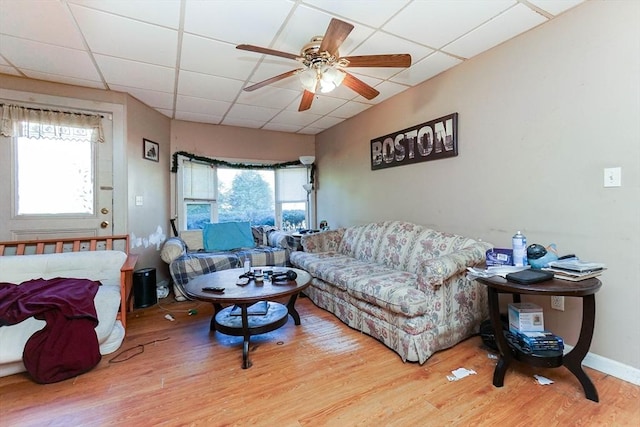 479 Main St, Hanson, MA 02341 - living area with a drop ceiling, wood finished floors, healthy amount of natural light, and a ceiling fan