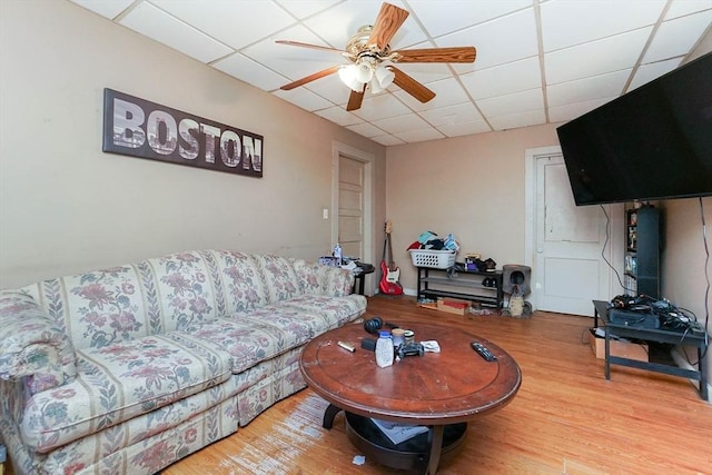 479 Main St, Hanson, MA 02341 - living area with a paneled ceiling, a ceiling fan, and wood finished floors