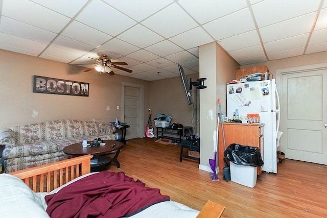 479 Main St, Hanson, MA 02341 - living room featuring a paneled ceiling, light wood finished floors, and a ceiling fan