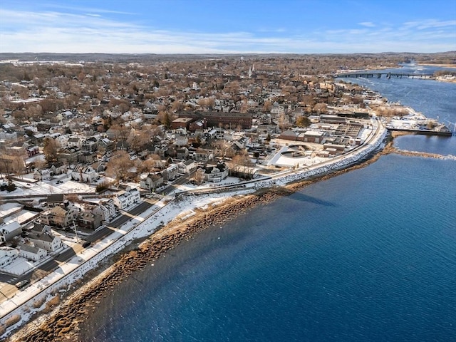 birds eye view of property with a water view and a view of the beach