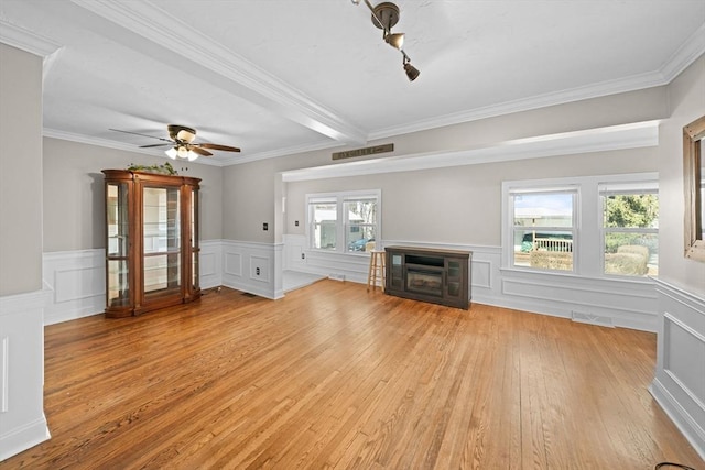 unfurnished living room featuring visible vents, light wood-style flooring, a fireplace, and ceiling fan