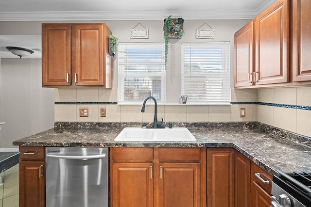 kitchen with tasteful backsplash, crown molding, brown cabinets, appliances with stainless steel finishes, and a sink