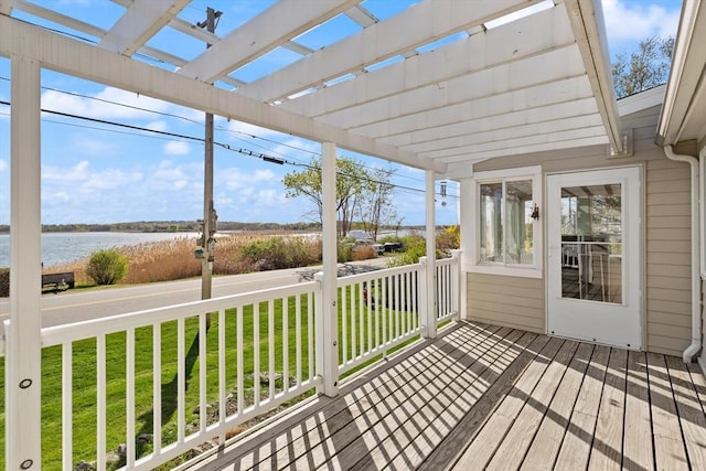 unfurnished sunroom featuring a water view and plenty of natural light