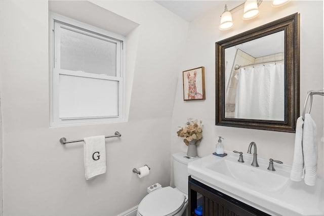 full bathroom featuring vanity and toilet