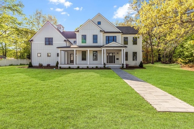 11 Cuba St, Andover, MA 01810 - modern farmhouse featuring a front lawn, board and batten siding, covered porch, and fence