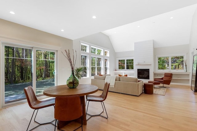 11 Cuba St, Andover, MA 01810 - dining area with vaulted ceiling, recessed lighting, a fireplace, and light wood-style floors