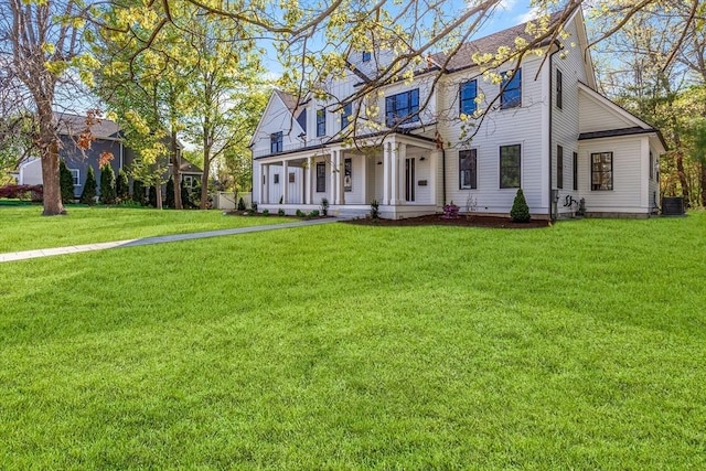 11 Cuba St, Andover, MA 01810 - view of front of house with central air condition unit, covered porch, and a front yard