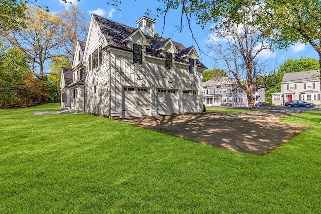 11 Cuba St, Andover, MA 01810 - rear view of property with a garage and a lawn