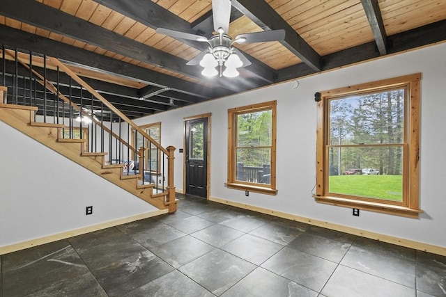 entrance foyer with baseboards, beamed ceiling, wooden ceiling, stairs, and a ceiling fan