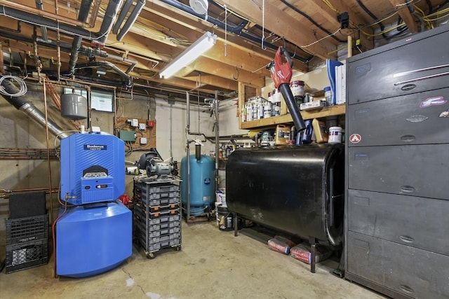 utility room featuring oil tank