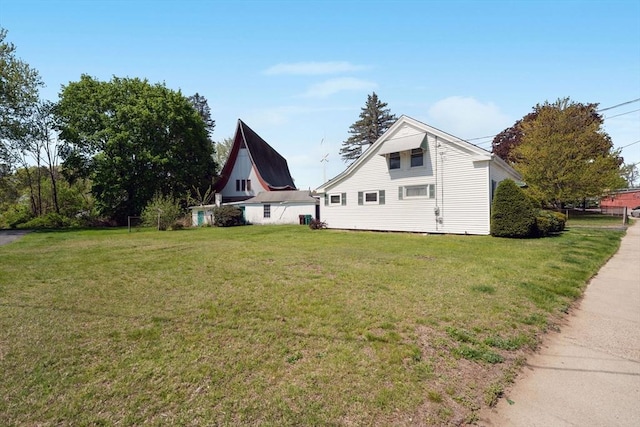view of home's exterior featuring a yard