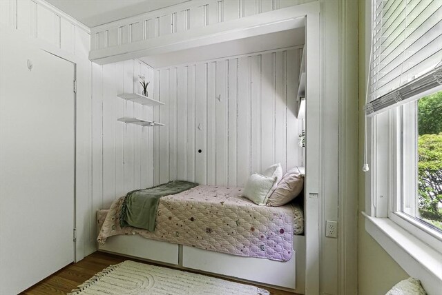 19 Mill Rd, Westborough, MA 01581 - bedroom featuring multiple windows, wood finished floors, and wooden walls