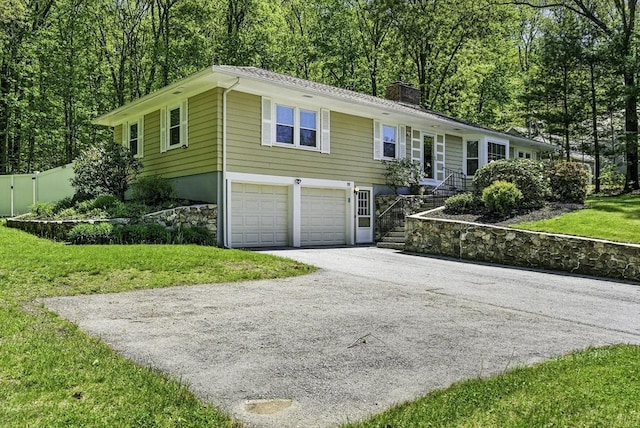 19 Mill Rd, Westborough, MA 01581 - single story home featuring a chimney, a garage, driveway, and a front lawn