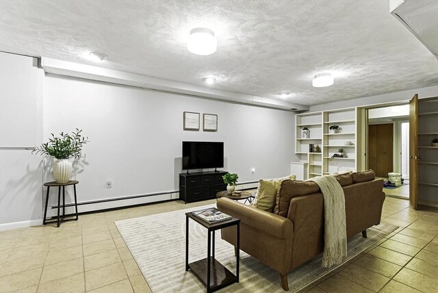 19 Mill Rd, Westborough, MA 01581 - living room featuring baseboard heating, light tile patterned floors, a textured ceiling, and baseboards