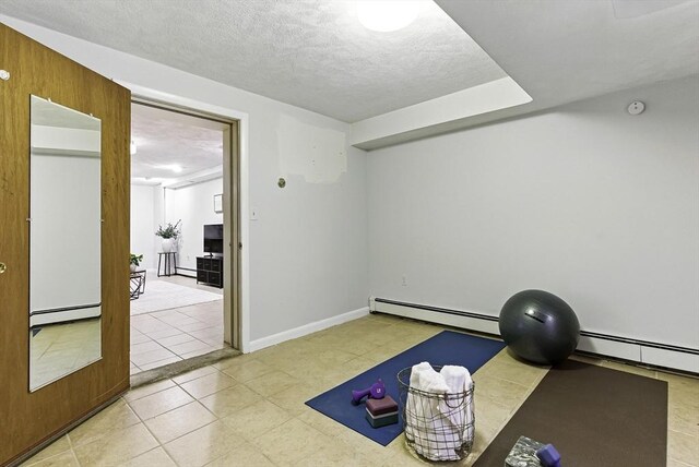 19 Mill Rd, Westborough, MA 01581 - workout room featuring a baseboard radiator, baseboard heating, tile patterned floors, and a textured ceiling