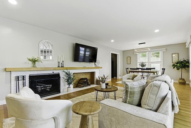 19 Mill Rd, Westborough, MA 01581 - living area featuring a brick fireplace, recessed lighting, baseboards, and wood finished floors