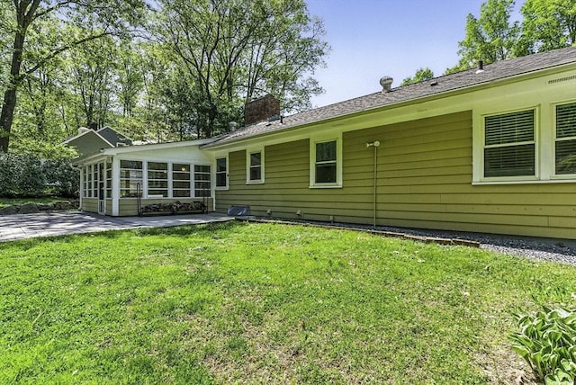 19 Mill Rd, Westborough, MA 01581 - rear view of property with a patio, a sunroom, a chimney, and a lawn