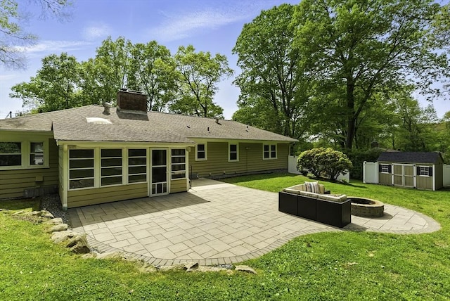 19 Mill Rd, Westborough, MA 01581 - rear view of house with an outdoor fire pit, a patio, a chimney, a storage unit, and a yard