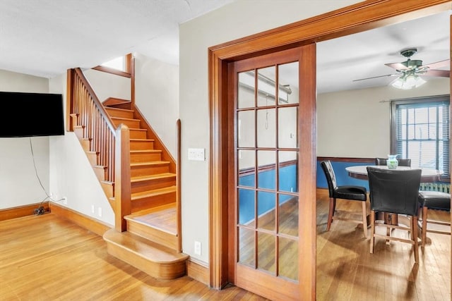 entryway featuring ceiling fan and wood-type flooring